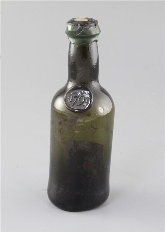 A rare Bristol black glass half wine bottle, height 18.5cm